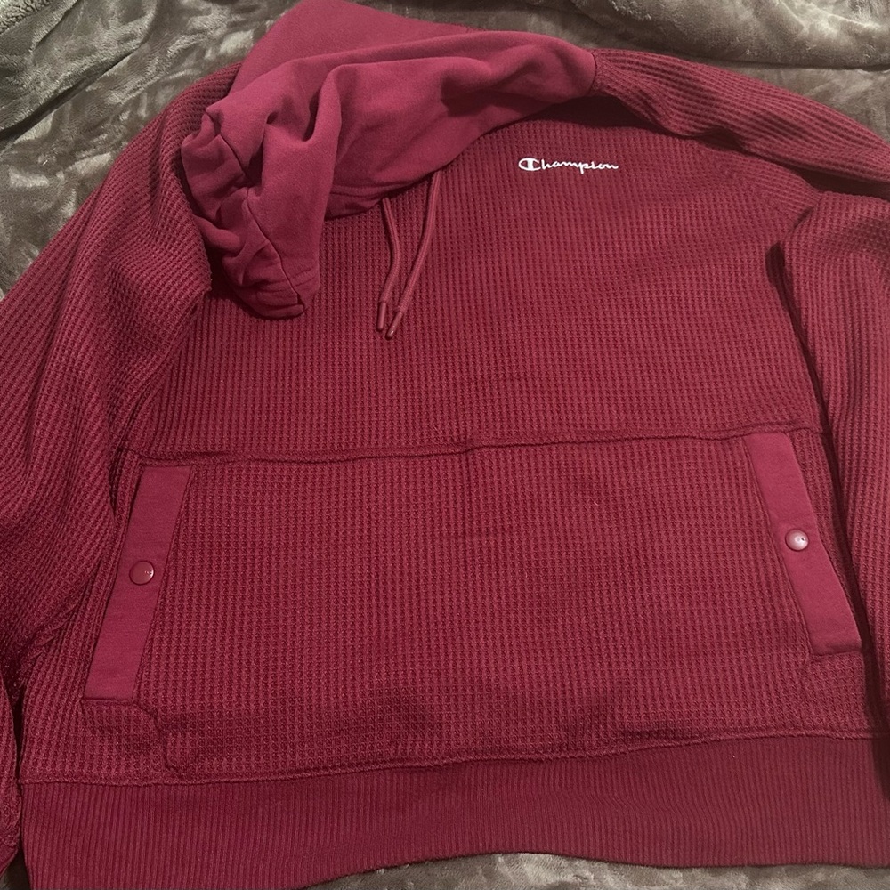 This is a burgundy Champion hoodie with a waffle texture. L Good condition